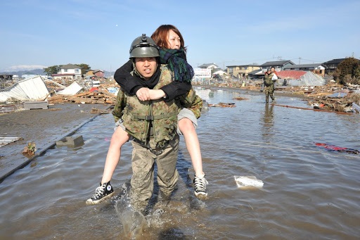SDF soldier rescuing citizens during the Great East Japan Earthquake