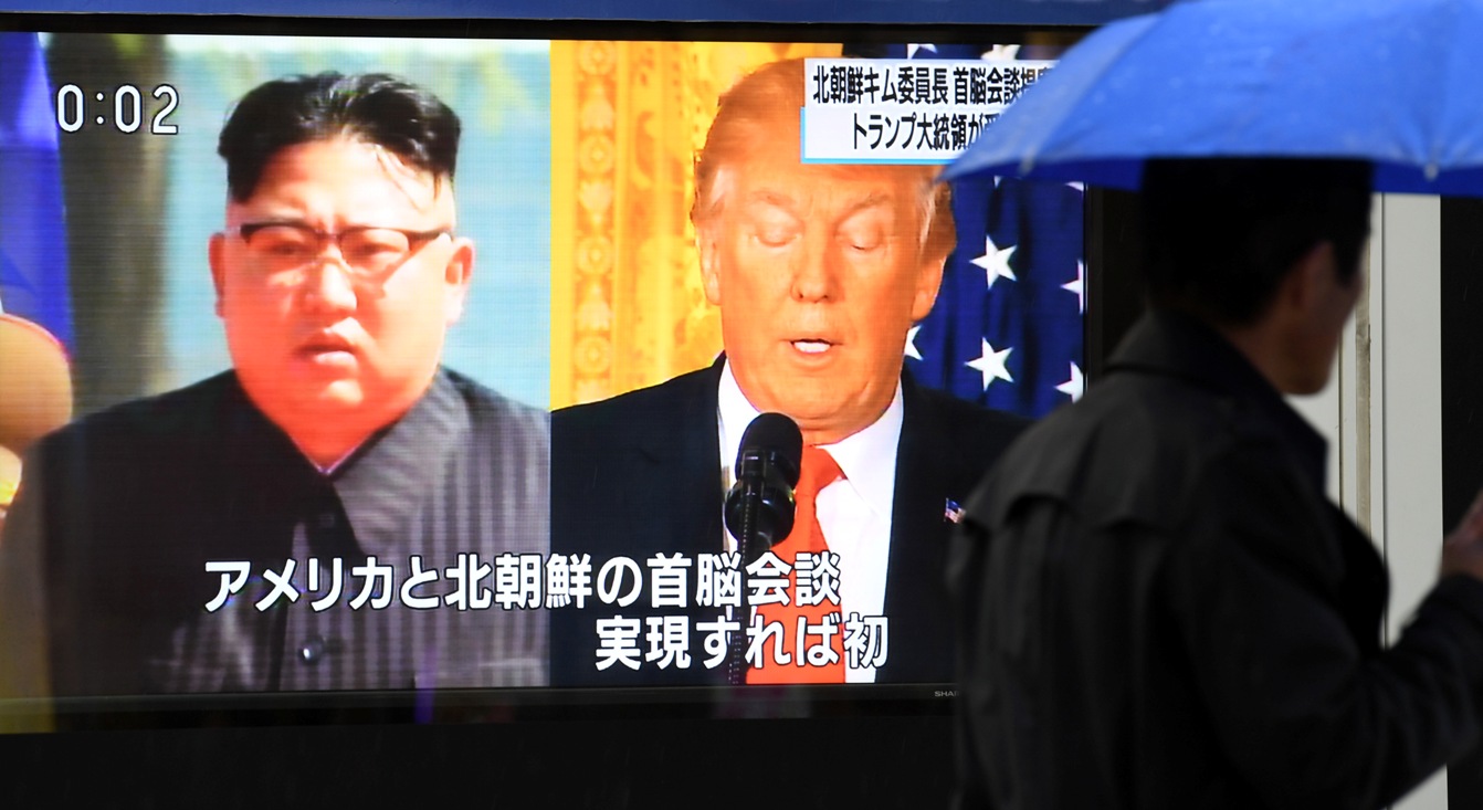 Kim Jong Un and Donald Trump on a television screen