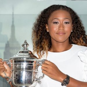 Naomi Osaka of Japan poses with the championship trophy at the Top of the Rock Observatory the day after winning the Women's Singles finals match against Serena Williams at the 2018 U.S. Open