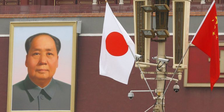 Chinese and Japanese flags flutter near Tiananmen Gate ahead of Japan's PM Abe's visit, in Beijing