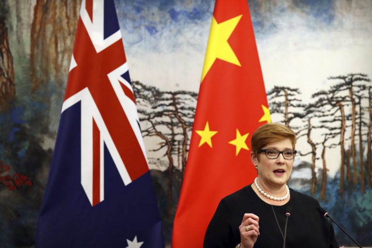 Australian Foreign Minister Marise Payne and Chinese Foreign Minister Wang Yi shake hands at a news conference at the Diaoyutai State Guesthouse in Beijing