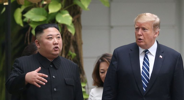 North Korea's leader Kim Jong Un and U.S. President Donald Trump talk in the garden of the Metropole hotel during the second North Korea-U.S. summit in Hanoi