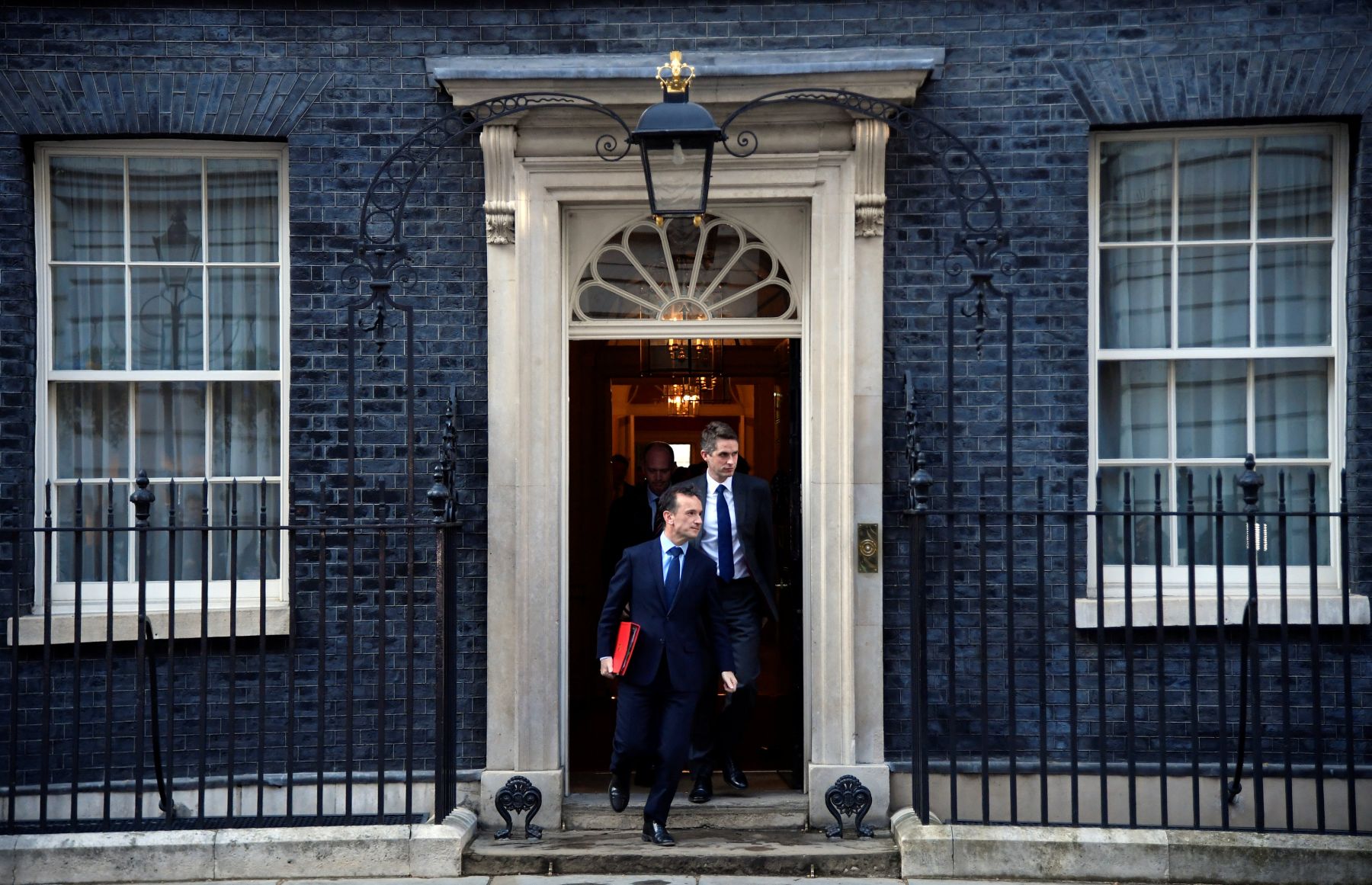 Britain’s Secretary of State for Wales Alun Cairns and Britain’s Secretary of State for Defence Gavin Williamson leave Downing Street in London