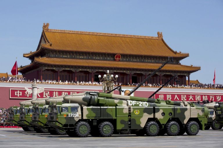 FILE PHOTO - Chinese military vehicles carrying DF-21D anti-ship ballistic missiles travel past Tiananmen Gate during a military parade to commemorate the 70th anniversary of the end of World War II in Beijing