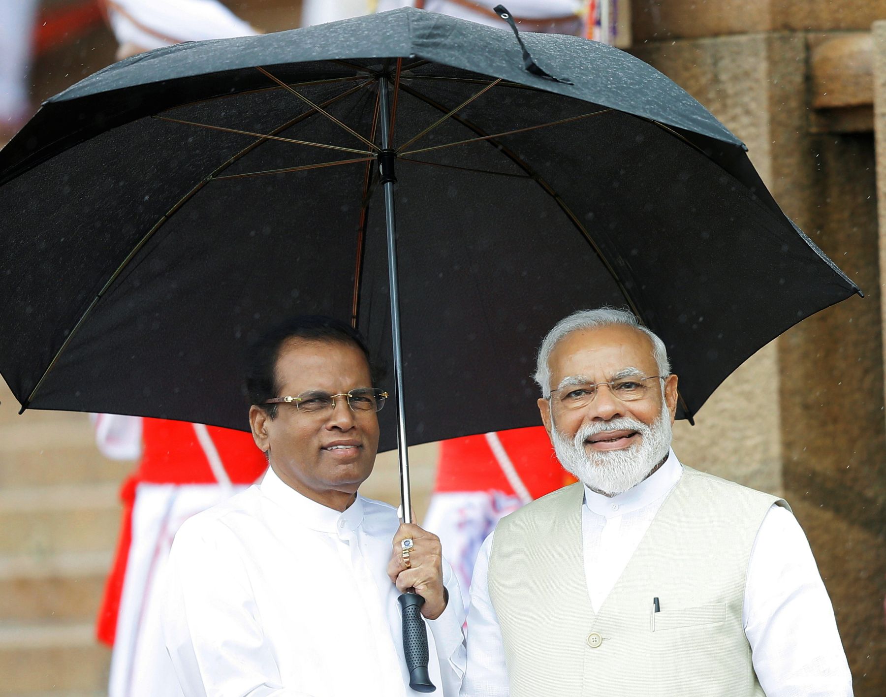 India's Prime Minister Narendra Modi is seen with Sri Lanka's President  Maithripala Sirisena during his welcome ceremony at the Presidential  Secretariat in Colombo