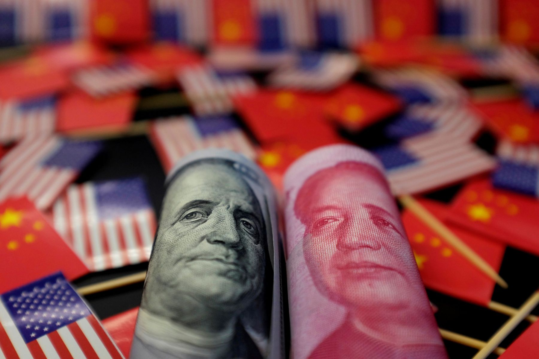 Illustration picture showing U.S. dollar and China’s yuan banknotes