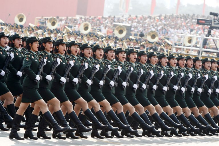 Soldiers of People's Liberation Army (PLA) march in formation during the military parade marking the 70th founding anniversary of People's Republic of China