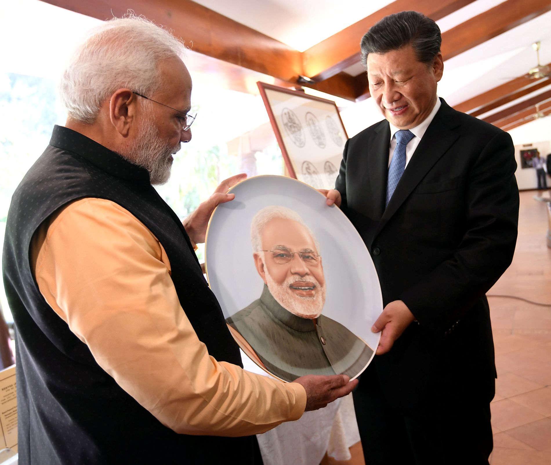 India’s Prime Minister Narendra Modi and China’s President Xi Jinping exchange gifts in Mamallapuram