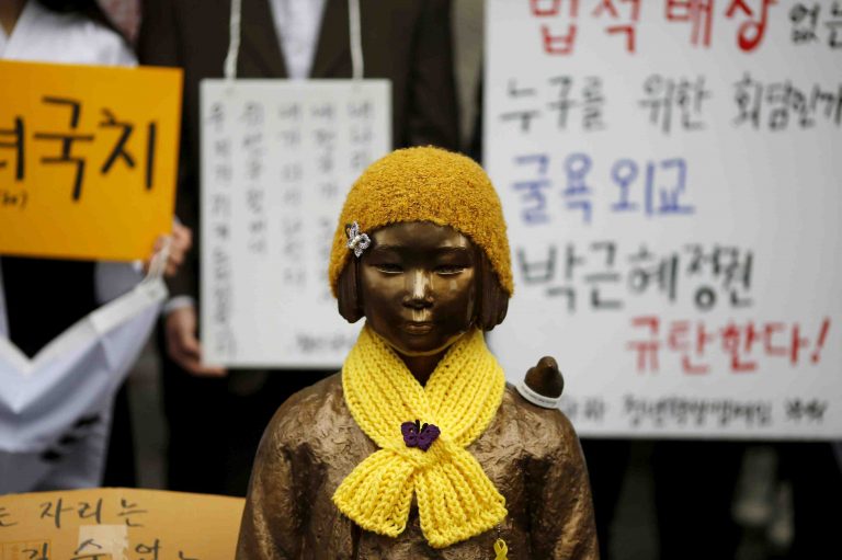 FILE PHOTO: A statue symbolizing "comfort women" is seen during a weekly anti-Japan rally in front of Japanese embassy in Seoul