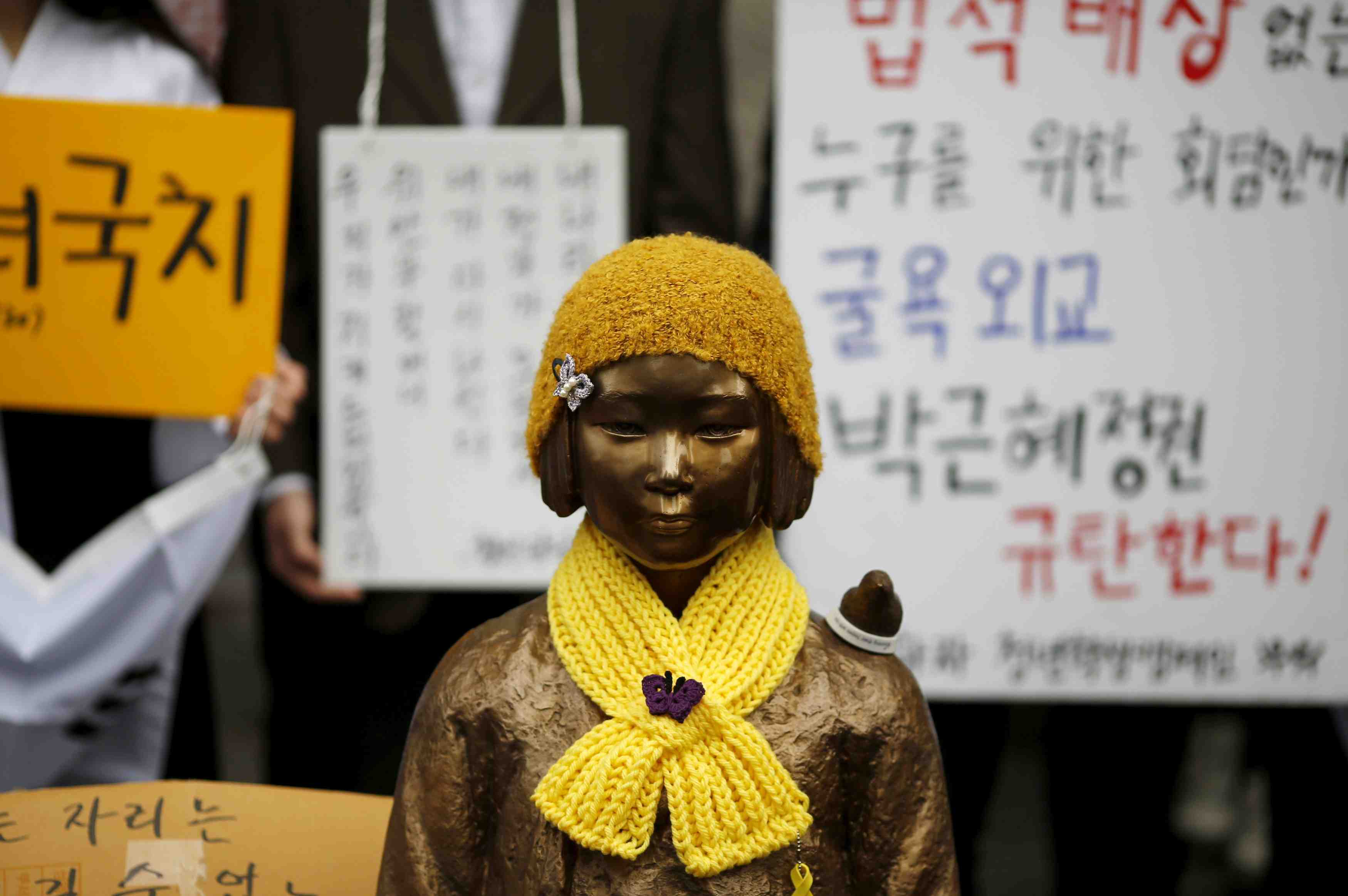 A statue symbolizing "comfort women" is seen during a weekly anti...