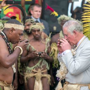 FILE PHOTO: Britain's Prince Charles, takes a drink with Chief Sine Mao Tirsupe, President of the Malvatumauri National Council of Chiefs, during a visit to the Chief's nakamal, as he visits the South Pacific island of Vanuatu