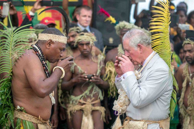 FILE PHOTO: Britain's Prince Charles, takes a drink with Chief Sine Mao Tirsupe, President of the Malvatumauri National Council of Chiefs, during a visit to the Chief's nakamal, as he visits the South Pacific island of Vanuatu