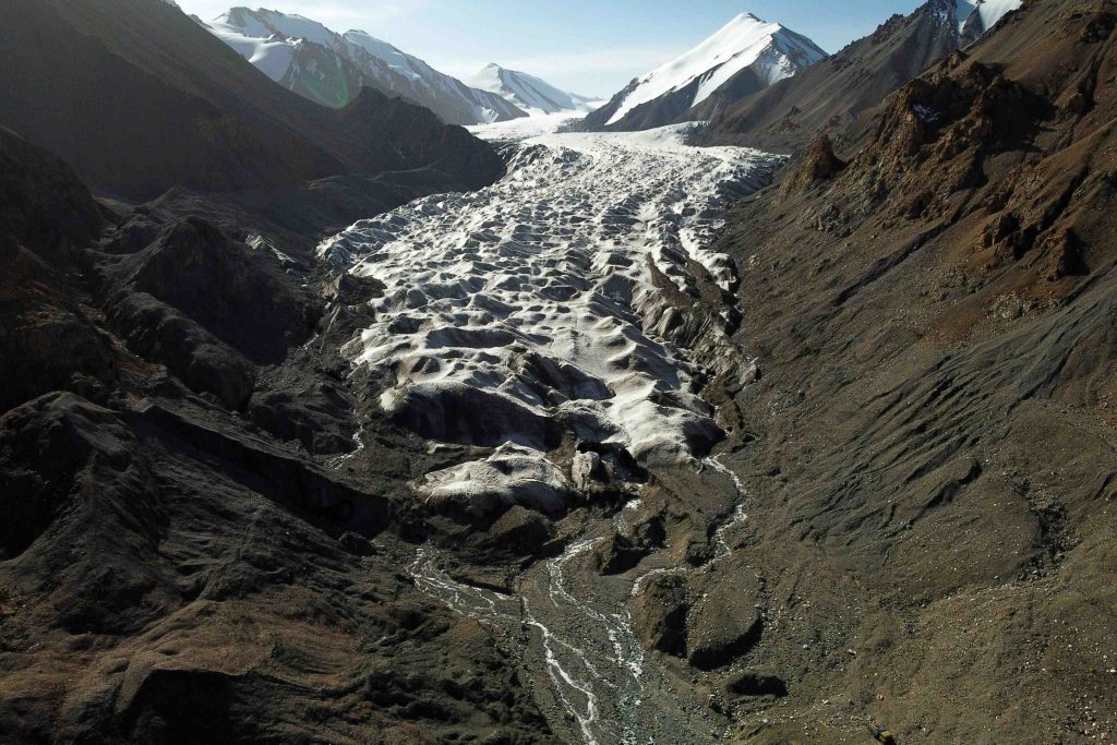 Meltwater from the Laohugou No. 12 glacier, flows though the Qilian mountains, Subei Mongol Autonomous County in Gansu province, China, September 27, 2020. Glaciers in China's bleak, rugged Qilian mountains are disappearing at a shocking rate as global warming brings unpredictable change and raises the prospect of crippling, long-term water shortages, scientists say. The largest glacier in the 800-km (500-mile) mountain chain on the arid northeastern edge of the Tibetan plateau has retreated about 450 metres since the 1950s, when researchers set up China's first monitoring station to study it. Picture taken with a drone. REUTERS/Carlos Garcia Rawlins SEARCH "RAWLINS GLACIER" FOR THIS STORY. SEARCH "WIDER IMAGE" FOR ALL STORIES.