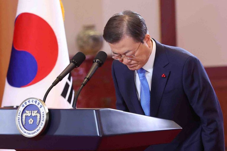 South Korean President Moon Jae-in bows before delivering the New Year's address at the Presidential Blue House in Seoul