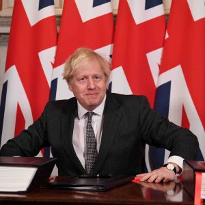 FILE PHOTO: Britain's Prime Minister Boris Johnson signs the Brexit trade deal with EU