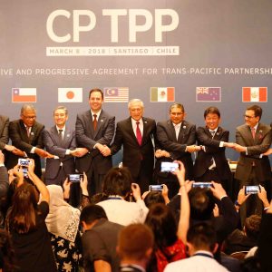 FILE PHOTO: Members of Trans-Pacific Partnership trade deal pose for an official picture after the signing agreement ceremony in Santiago