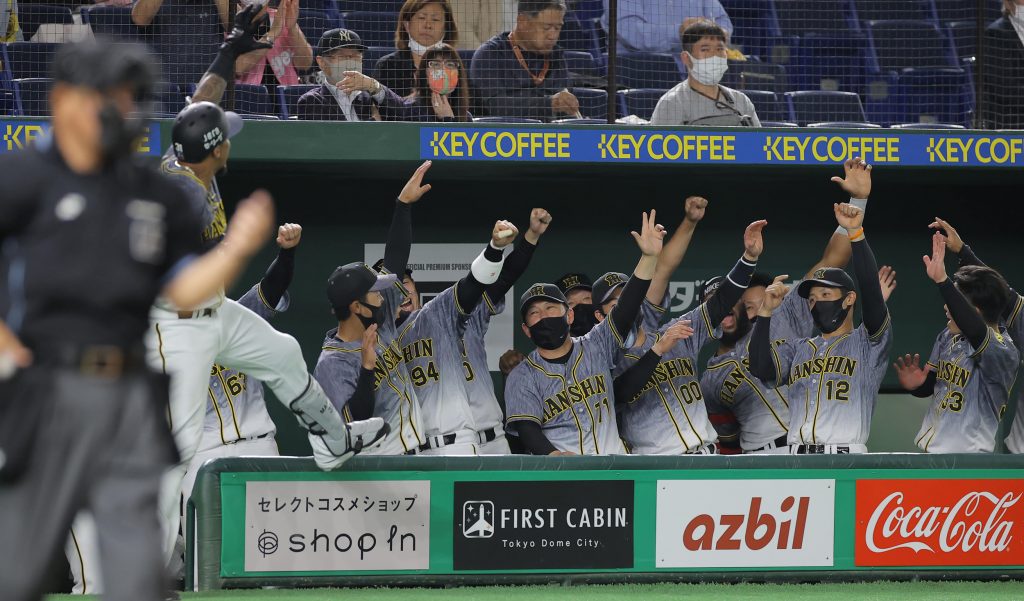 A baseball game between the DeNA BayStars and the Hanshin Tigers is played  at Yokohama Stadium on Nov. 1, 2020, the last day of a three-day trial to  study ways to mitigate