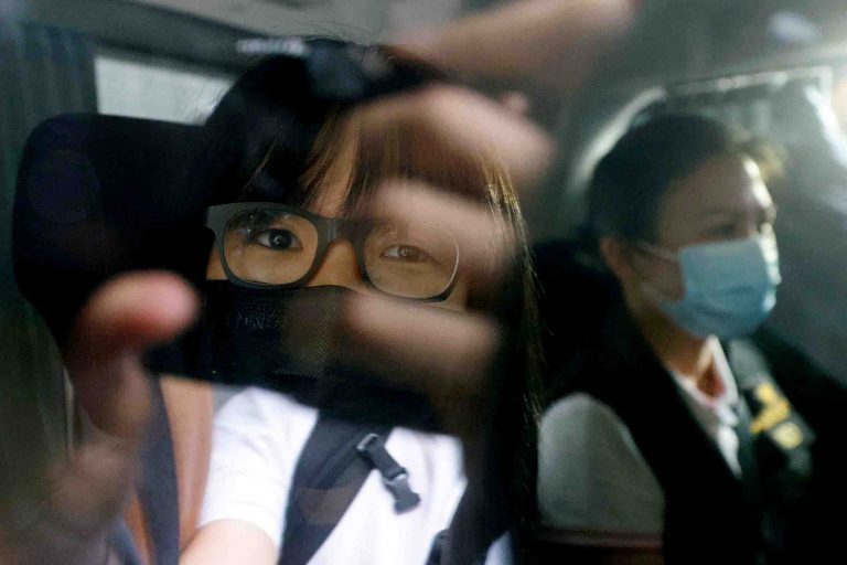 FILE PHOTO: Hong Kong Alliance in Support of Patriotic Democratic Movements of China Vice-Chairwoman Tonyee Chow is seen inside a vehicle after being detained in Hong Kong