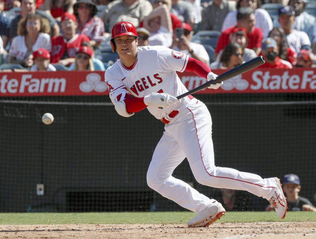 Shohei Ohtani reports to Angels with physical, swings and long toss