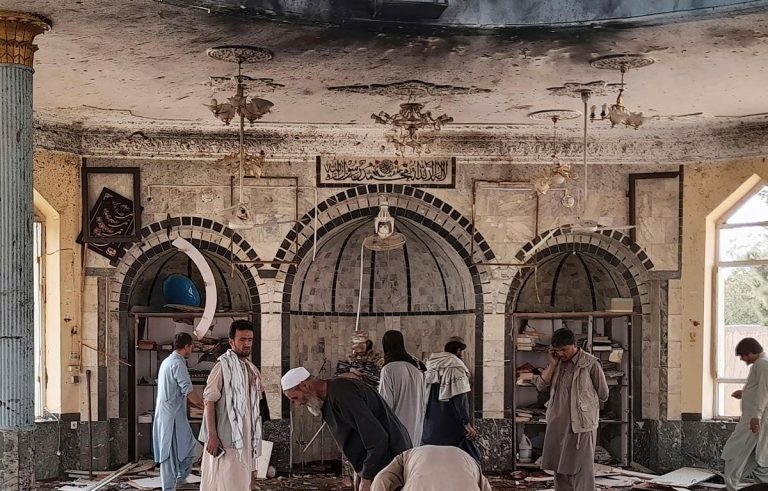 Investigating explosion damage to mosque in Kunduz Afghanistan (October 8, AP)