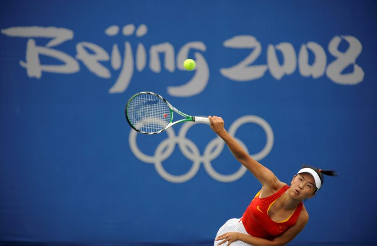 FILE PHOTO: Peng Shuai of China returns a shot against Carla Suarez Navarro of Spain during their women's first round tennis match at the Beijing 2008 Olympic Games