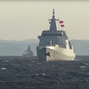 A group of naval vessels from China and Russia sail during joint military drills in the Sea of Japan