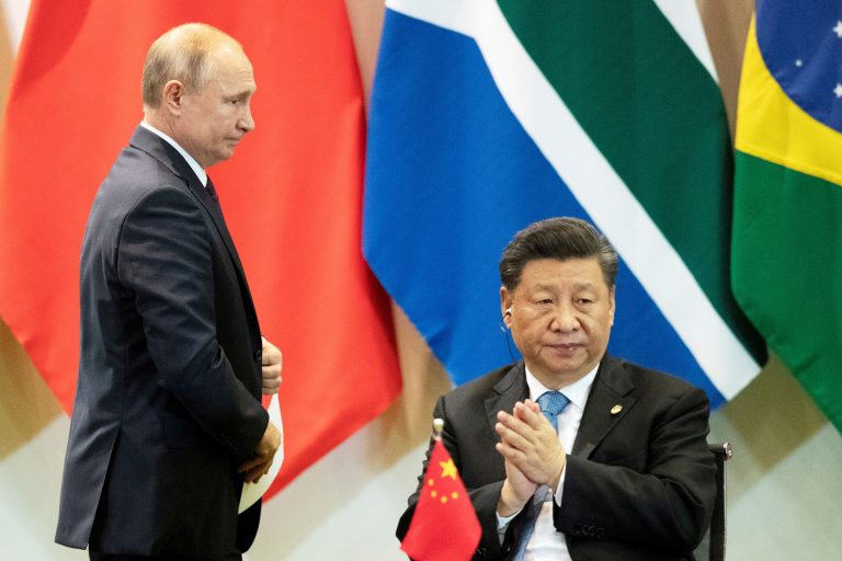 FILE PHOTO: China's President Xi Jinping and Russia's President Vladimir Putin attend a meeting with members of the Business Council and management of the New Development Bank during the BRICS emerging economies at the Itamaraty palace in Brasilia