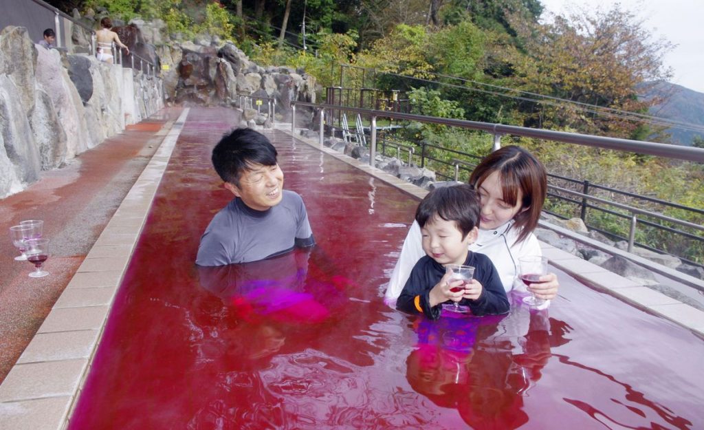 Hakone, Japan. 04th Feb, 2023. Bathers enjoy in a colored with