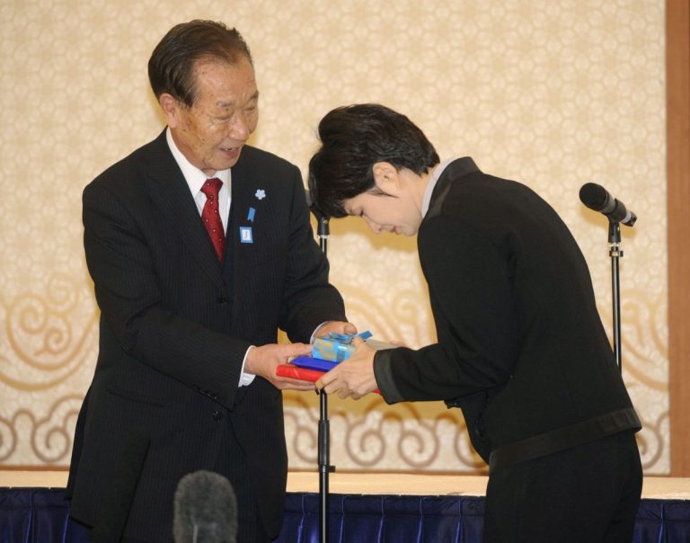 Shigeo Iizuka with Kim Hyon-Hui who identified his sister r