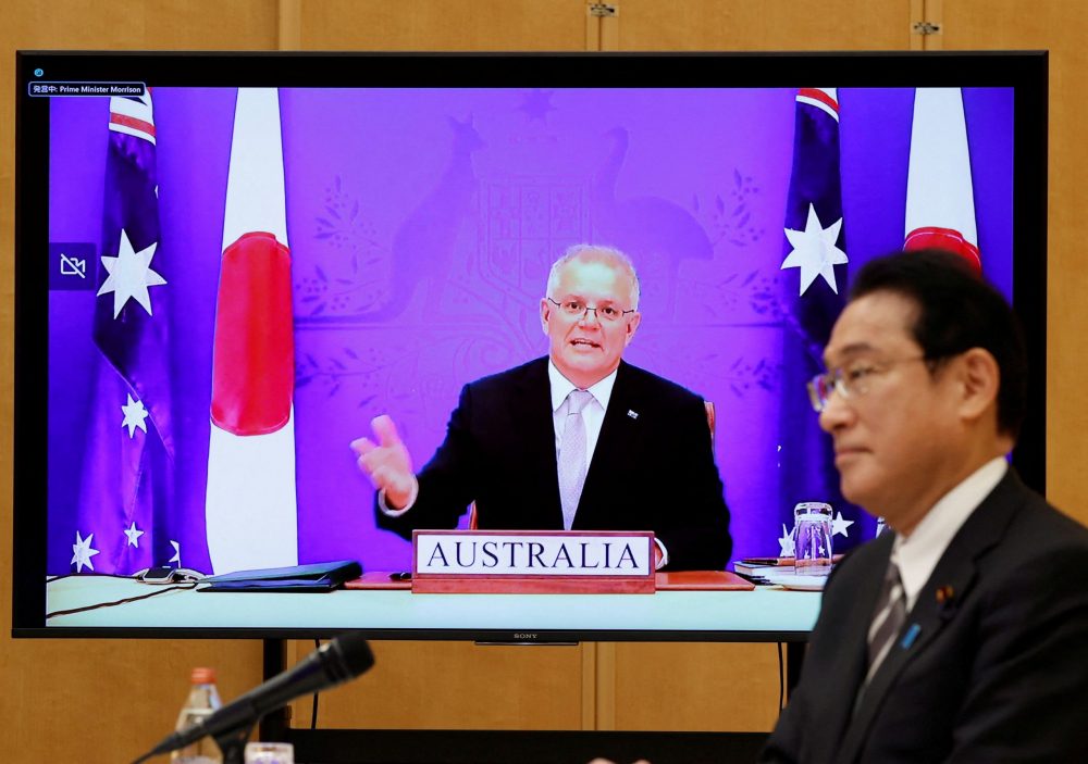 Japan’s Prime Minister Fumio Kishida and Australia’s Prime Minister Scott Morrison attend a video signing ceremony of the bilateral reciprocal access agreement in Tokyo