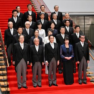 Japanese Prime Minister Fumio Kishida poses with his new cabinet at his official residence in Tokyo