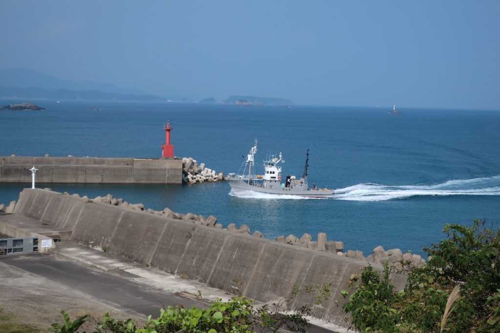 A whaling ship enters the local harbor in Taiji.